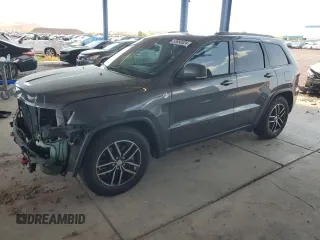2018 Jeep Grand Cherokee Trailhawk with VIN 1C4RJFLT8JC318669, listed as a Copart auction lot 63060524 with 74,587 mi miles and Salvage Title. Bid and sale history available at carsss.com. Image 1.