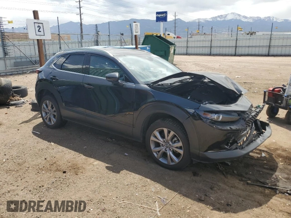 2023 Mazda CX-30 S Premium with VIN 3MVDMBDMXPM527113, listed as a Copart auction lot 57169165 with 49,040 mi miles and Salvage title. Bid and sale history available at DreamBid. Image 4.