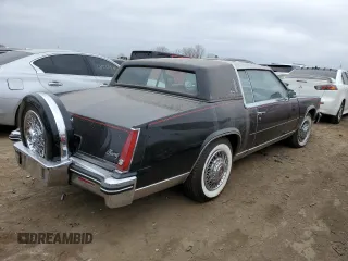 1985 Cadillac Eldorado z VIN 1G6EL5782FE634074, wystawiony jako Copart lot #44520964 z przebiegiem 74 425 mil mil oraz Szkody całkowita. Historia ofert i sprzedaży dostępna na DreamBid. Obrazek 3.