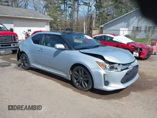 2014 Scion tC with VIN JTKJF5C70E3068144, listed as a IAAI auction lot 41983751 with 137,894 mi miles. Bid and sale history available at carsss.com. Image 1.