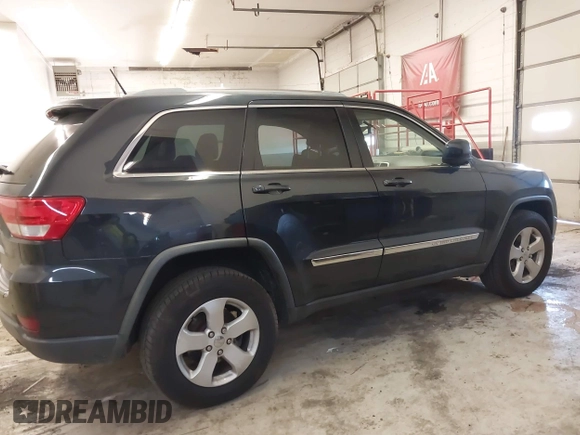 2012 Jeep Grand Cherokee Laredo with VIN 1C4RJFAG5CC351539, listed as a IAAI auction lot 41861533 with 166,909 mi miles. Bid and sale history available at carsss.com. Image 13.
