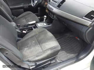 2012 Mitsubishi Lancer ES with VIN JA32U2FU5CU029556, listed as a IAAI auction lot 42104297 with 111,821 mi miles. Bid and sale history available at carsss.com. Image 5.