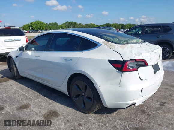 2020 Tesla Model 3 Standard Range Plus with VIN 5YJ3E1EA6LF799620, listed as a IAAI auction lot 42221643 with 55,458 mi miles and . Bid and sale history available at carsss.com. Image 3.