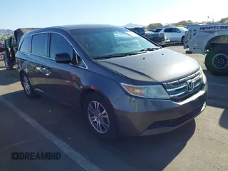 2011 Honda Odyssey EX-L with VIN 5FNRL5H6XBB083980, listed as a IAAI auction lot 42100308 with 191,361 mi miles and . Bid and sale history available at carsss.com. Image 1.
