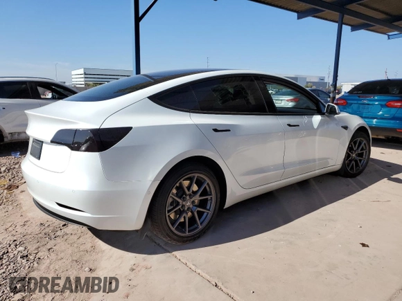 2021 Tesla Model 3 Standard Range Plus with VIN 5YJ3E1EA7MF978749, listed as a Copart auction lot 43377955 with 51,871 mi miles and Salvage Title. Bid and sale history available at carsss.com. Image 3.