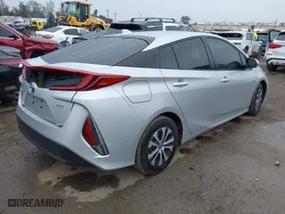 2021 Toyota Prius Prime LE with VIN JTDKAMFP9M3188569, listed as a IAAI auction lot 41712793 with 144,722 mi miles. Bid and sale history available at carsss.com. Image 4.