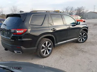 2024 Honda Pilot Touring with VIN 5FNYG1H72RB007519, listed as a IAAI auction lot 40973780 with 24,908 mi miles. Bid and sale history available at carsss.com. Image 4.