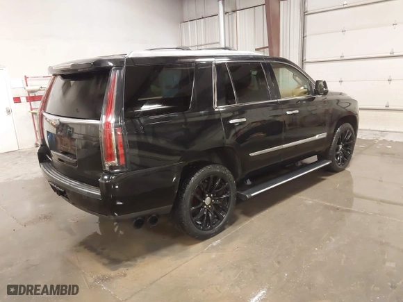 2015 Cadillac Escalade Platinum with VIN 1GYS4PKJ9FR745825, listed as a IAAI auction lot 41201715 with 133,363 mi miles. Bid and sale history available at carsss.com. Image 4.