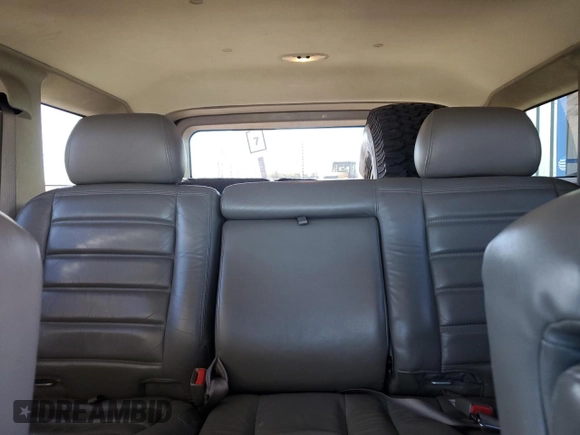 2003 Hummer H2 with VIN 5GRGN23U33H125797, listed as a Copart auction lot 77170554 with 166,739 mi miles and Clean Title. Bid and sale history available at carsss.com. Image 10.