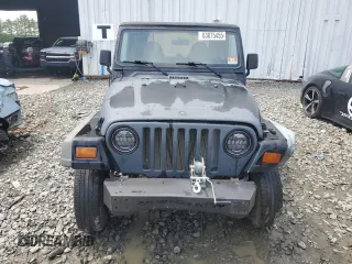1999 Jeep Wrangler SE z VIN 1J4FY29P0XP479580, wystawiony jako Copart lot #63075455 z przebiegiem 160 986 mil mil oraz Szkoda całkowita • Salvage title. Historia ofert i sprzedaży dostępna na DreamBid. Obrazek 5.