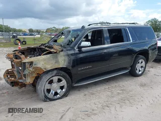 2015 Chevrolet Suburban LTZ with VIN 1GNSCKKC8FR156706, listed as a IAAI auction lot 40638221 with Not Provided miles and . Bid and sale history available at DreamBid. Image 2.