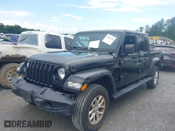 2023 Jeep Gladiator Sport S z VIN 1C6HJTAG3PL521954, wystawiony jako IAAI lot #42502126 z przebiegiem 49 606 mil mil oraz . Historia ofert i sprzedaży dostępna na DreamBid. Obrazek 14.