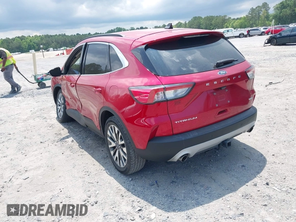 2020 Ford Escape Titanium z VIN 1FMCU9J92LUA39457, wystawiony jako IAAI lot #42222441 z przebiegiem 107 148 mil mil oraz . Historia ofert i sprzedaży dostępna na DreamBid. Obrazek 3.