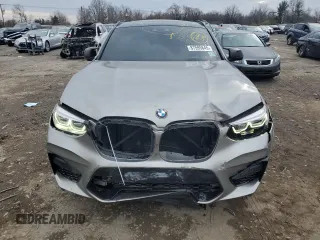 2021 BMW X4 M z VIN 5YMUJ0C03M9F20053, wystawiony jako Copart lot #87595845 z przebiegiem Nie podano mil oraz Szkody całkowita. Historia ofert i sprzedaży dostępna na DreamBid. Obrazek 5.