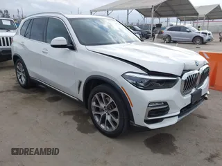 2021 BMW X5 xDrive40i with VIN 5UXCR6C03M9G36156, listed as a IAAI auction lot 42125009 with 30,877 mi miles. Bid and sale history available at carsss.com. Image 1.
