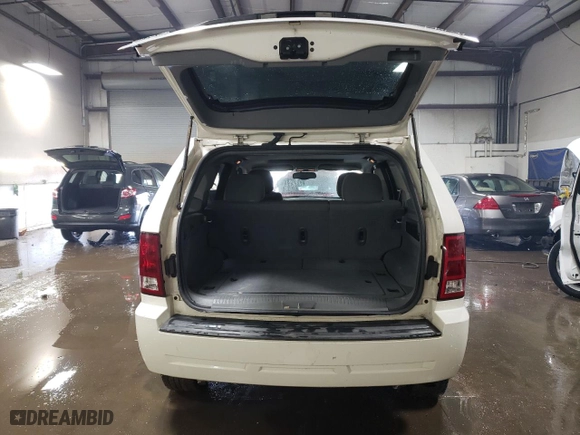 2005 Jeep Grand Cherokee Laredo with VIN 1J4HR48N75C679152, listed as a Copart auction lot 46933765 with 221,299 mi miles and Salvage Title. Bid and sale history available at carsss.com. Image 6.