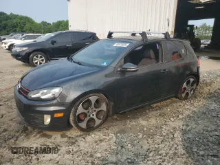 2012 Volkswagen Golf GTI w/Conv & Sunroof with VIN WVWEV7AJ7CW009478, listed as a Copart auction lot 58974025 with 124,472 mi miles and Salvage title. Bid and sale history available at DreamBid. Image 1.