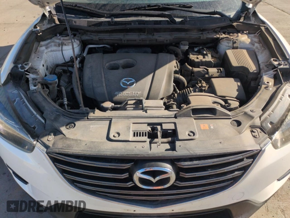 2016 Mazda CX-5 Grand Touring with VIN JM3KE4DY8G0671256, listed as a Copart auction lot 52920975 with 87,822 mi miles and Non Repairable. Bid and sale history available at carsss.com. Image 12.