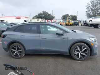 2023 Volkswagen ID.4 S z VIN 1V25MPE80PC051099, wystawiony jako IAAI lot #41332507 z przebiegiem 12 037 mil mil oraz . Historia ofert i sprzedaży dostępna na DreamBid. Obrazek 13.