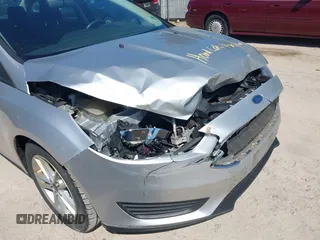 2017 Ford Focus SE z VIN 1FADP3F21HL237412, wystawiony jako IAAI lot #42188886 z przebiegiem 148 355 mil mil oraz . Historia ofert i sprzedaży dostępna na DreamBid. Obrazek 12.