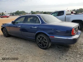 2004 Jaguar XJ with VIN SAJWA71C34SG19800, listed as a Copart auction lot 71877194 with 157,051 mi miles and Salvage Title. Bid and sale history available at carsss.com. Image 2.