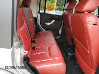 2013 Jeep Wrangler Unlimited Rubicon 10th Anniversary z VIN 1C4HJWFG3DL703331, wystawiony jako Copart lot #70823154 z przebiegiem 148 860 mil mil oraz Szkoda całkowita • Salvage title. Historia ofert i sprzedaży dostępna na DreamBid. Obrazek 10.