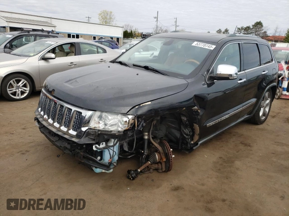 2011 Jeep Grand Cherokee Overland with VIN 1J4RR6GT9BC660730, listed as a Copart auction lot 53770745 with 106,351 mi miles and Salvage title. Bid and sale history available at DreamBid. Image 1.