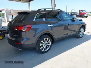 2014 Mazda CX-9 Grand Touring z VIN JM3TB2DA0E0434181, wystawiony jako IAAI lot #42295436 z przebiegiem 78 372 mil mil oraz . Historia ofert i sprzedaży dostępna na DreamBid. Obrazek 4.