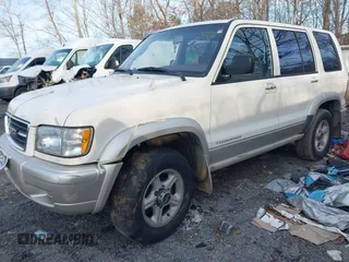 1999 Isuzu Trooper S with VIN JACDJ58X1X7928946, listed as a IAAI auction lot 41310880 with Not Provided miles and . Bid and sale history available at DreamBid. Image 2.