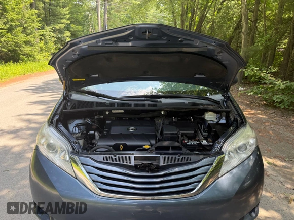 2015 Toyota Sienna LE AAS with VIN 5TDKK3DC1FS623710, listed as a Copart auction lot 62335575 with 221,148 mi miles and Clean title. Bid and sale history available at DreamBid. Image 7.