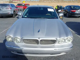 2004 Jaguar XJ with VIN SAJWA73B94TG30153, listed as a IAAI auction lot 41218841 with 91,158 mi miles. Bid and sale history available at carsss.com. Image 12.