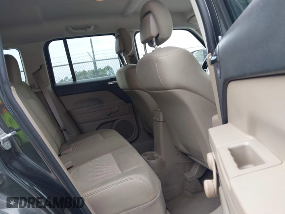 2011 Jeep Patriot Latitude with VIN 1J4NT1GA0BD129377, listed as a IAAI auction lot 42098404 with 212,834 mi miles. Bid and sale history available at carsss.com. Image 8.