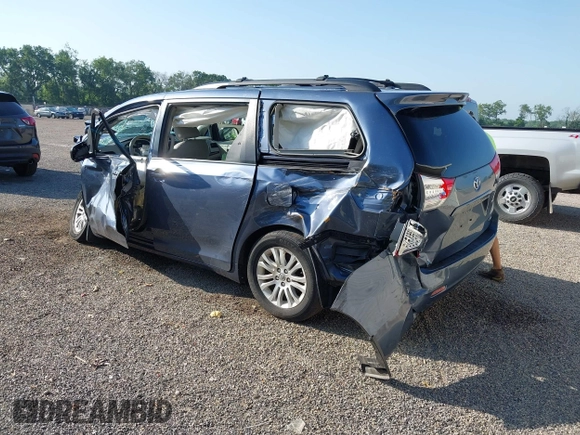 2014 Toyota Sienna XLE with VIN 5TDYK3DCXES524294, listed as a IAAI auction lot 42546467 with 122,257 mi miles and . Bid and sale history available at DreamBid. Image 3.