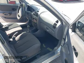 2002 Hyundai Accent GL with VIN KMHCG45C82U268756, listed as a IAAI auction lot 41569829 with 89,752 mi miles. Bid and sale history available at carsss.com. Image 5.
