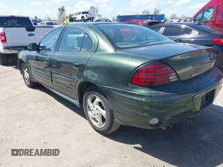 2000 Pontiac Grand Am SE1 with VIN 1G2NF52T0YM808611, listed as a IAAI auction lot 41943125 with 132,887 mi miles. Bid and sale history available at carsss.com. Image 3.
