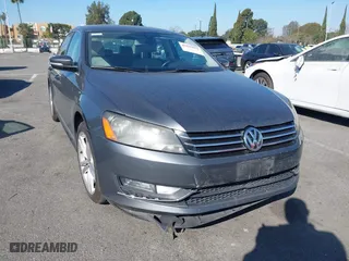 2015 Volkswagen Passat 1.8T Sport with VIN 1VWBT7A36FC020582, listed as a IAAI auction lot 41625054 with 98,613 mi miles. Bid and sale history available at carsss.com. Image 1.