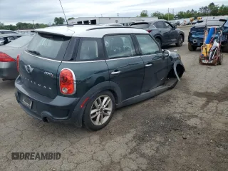 2014 MINI Countryman S with VIN WMWZC5C58EWP39797, listed as a Copart auction lot 62193515 with 84,989 mi miles and Salvage title. Bid and sale history available at DreamBid. Image 3.