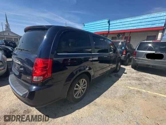 2014 Dodge Grand Caravan SXT with VIN 2C4RDGCG1ER308403, listed as a Copart auction lot 47603045 with 131,847 mi miles and Clean Title. Bid and sale history available at DreamBid. Image 4.