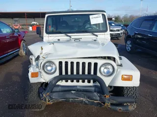 2002 Jeep Wrangler Sahara with VIN 1J4FA59S62P772256, listed as a IAAI auction lot 41968844 with 170,218 mi miles. Bid and sale history available at carsss.com. Image 12.