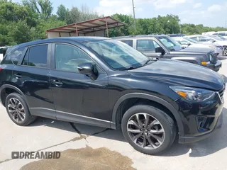 2016 Mazda CX-5 Grand Touring z VIN JM3KE2DY2G0765444, wystawiony jako IAAI lot #42527577 z przebiegiem 162 871 mil mil oraz . Historia ofert i sprzedaży dostępna na DreamBid. Obrazek 13.
