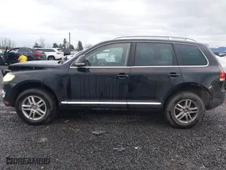 2009 Volkswagen Touareg 2 VR6 with VIN WVGBE77L29D010730, listed as a IAAI auction lot 41109415 with 230,325 mi miles. Bid and sale history available at carsss.com. Image 14.
