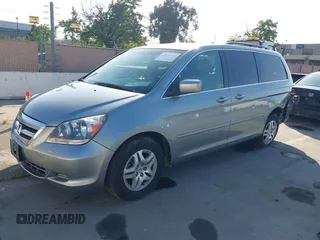 2007 Honda Odyssey EX-L with VIN 5FNRL38727B028976, listed as a IAAI auction lot 42138341 with 169,936 mi miles. Bid and sale history available at carsss.com. Image 2.