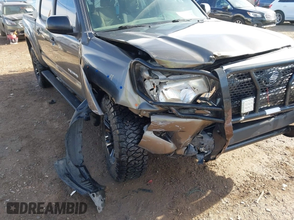 2014 Toyota Tacoma with VIN 3TMLU4EN3EM143882, listed as a IAAI auction lot 40657975 with 125,008 mi miles. Bid and sale history available at carsss.com. Image 6.