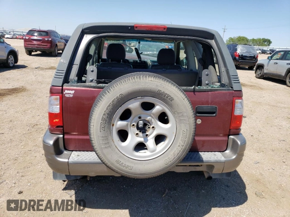 2002 Isuzu Rodeo z VIN 4S2CK57W324328446, wystawiony jako Copart lot #58097174 z przebiegiem 118 514 mil mil oraz Szkoda całkowita • Salvage title. Historia ofert i sprzedaży dostępna na DreamBid. Obrazek 6.