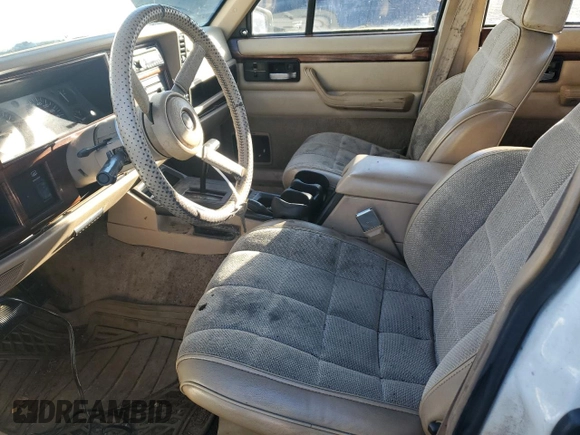 1993 Jeep Cherokee Country with VIN 1J4FJ78S0PL565292, listed as a Copart auction lot 83214974 with 233,925 mi miles and Clean Title. Bid and sale history available at carsss.com. Image 7.