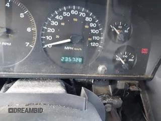 1999 Jeep Grand Cherokee Limited with VIN 1J4GW68NXXC637464, listed as a IAAI auction lot 41561690 with 235,728 mi miles. Bid and sale history available at carsss.com. Image 7.