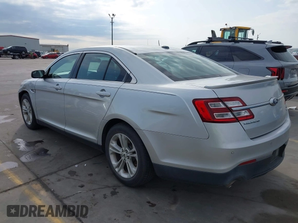 2015 Ford Taurus SEL z VIN 1FAHP2E88FG133328, wystawiony jako IAAI lot #42179649 z przebiegiem 127 171 mil mil oraz . Historia ofert i sprzedaży dostępna na DreamBid. Obrazek 3.