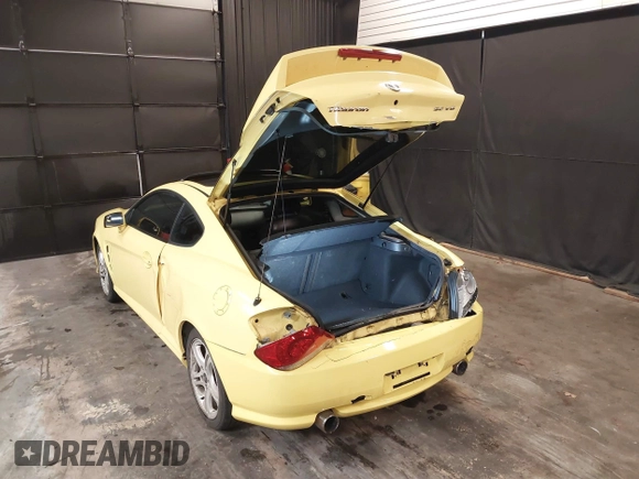 2006 Hyundai Tiburon GT z VIN KMHHN65F56U225936, wystawiony jako IAAI lot #41695280 z przebiegiem 121 110 mil mil oraz . Historia ofert i sprzedaży dostępna na DreamBid. Obrazek 3.