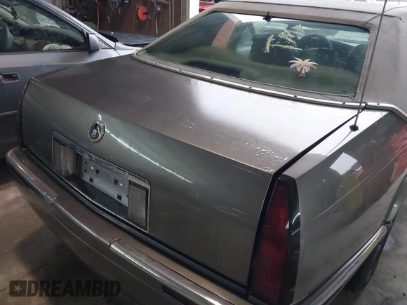 1999 Cadillac Eldorado ESC z VIN 1G6EL12Y8XU612393, wystawiony jako IAAI lot #41761839 z przebiegiem 104 994 mil mil oraz . Historia ofert i sprzedaży dostępna na DreamBid. Obrazek 6.