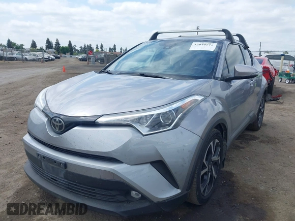 2019 Toyota C-HR XLE with VIN JTNKHMBX3K1016723, listed as a IAAI auction lot 42040571 with 158,804 mi miles. Bid and sale history available at carsss.com. Image 2.